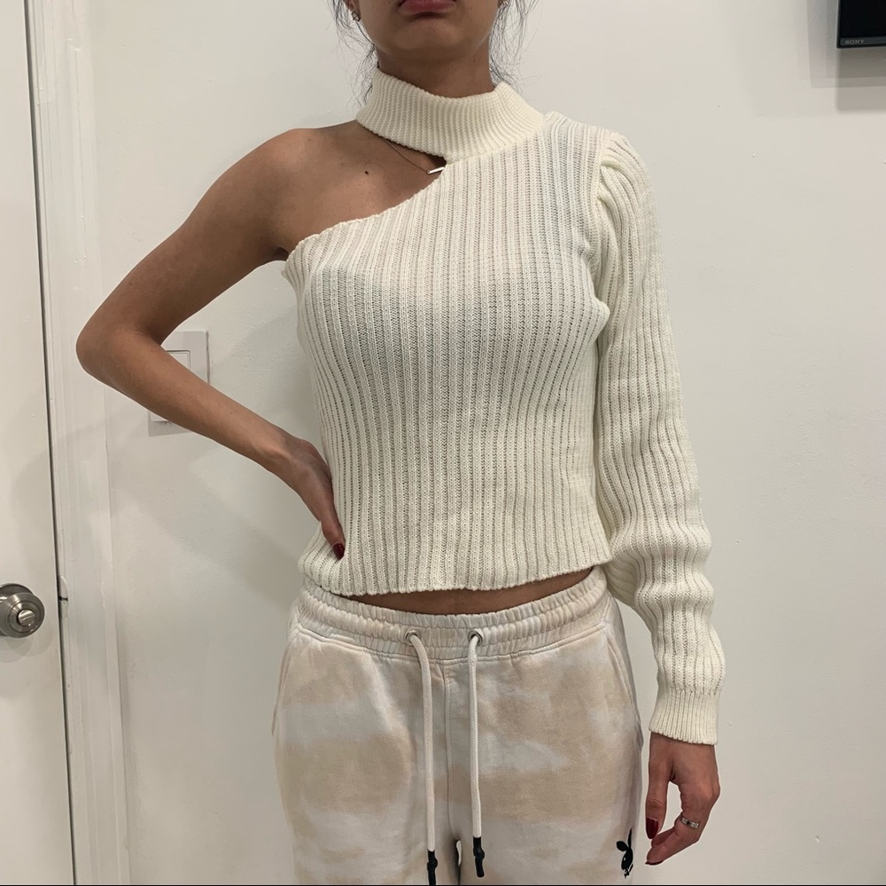 One sleeve cream colored sweater